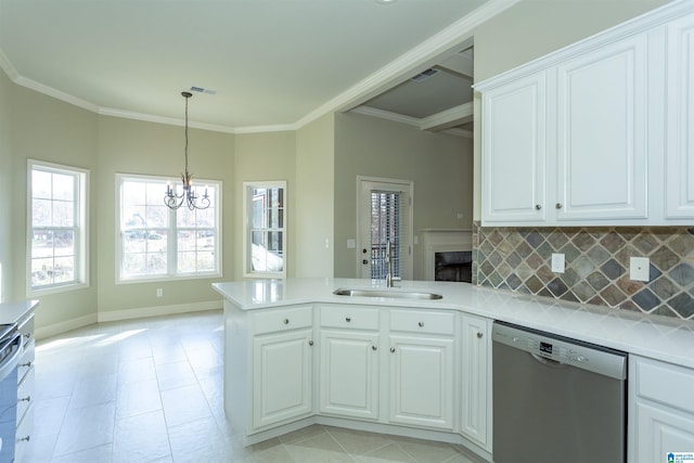 kitchen featuring white cabinetry, stainless steel dishwasher, backsplash, kitchen peninsula, and a chandelier