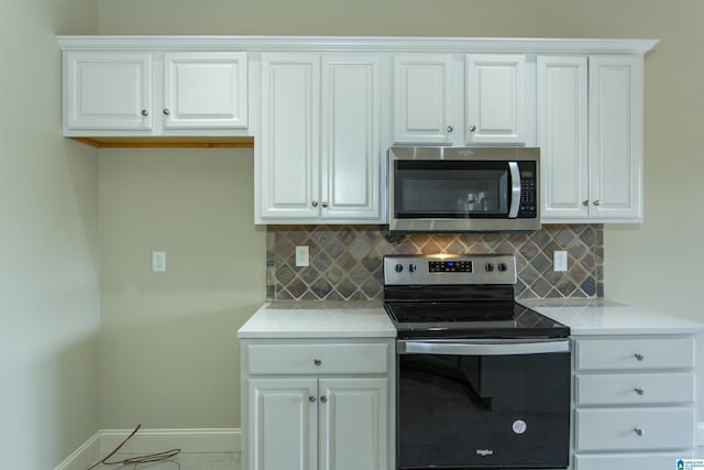 kitchen with stainless steel appliances and white cabinetry