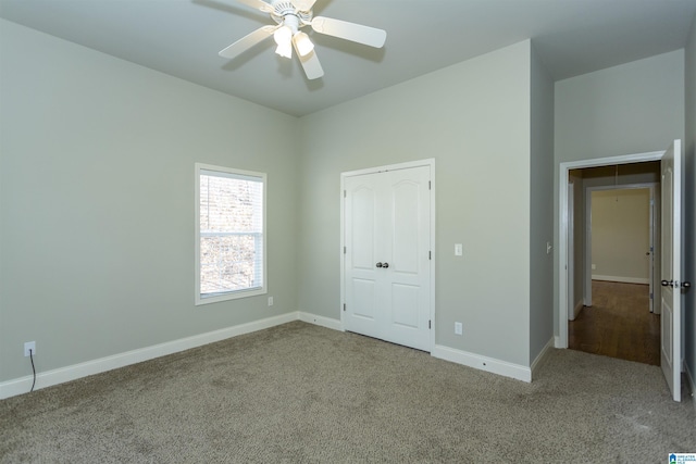 unfurnished bedroom with light carpet, a closet, and ceiling fan