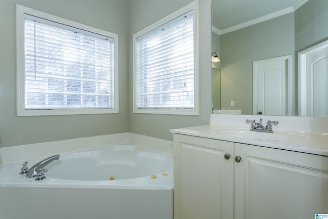 bathroom featuring a bathing tub, vanity, and crown molding