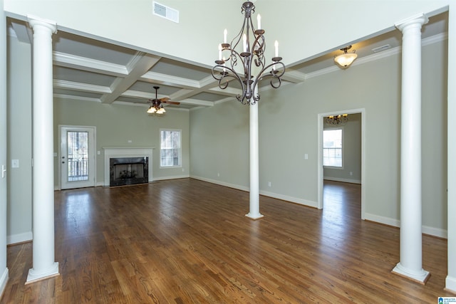 unfurnished living room with a premium fireplace, crown molding, ceiling fan with notable chandelier, and dark hardwood / wood-style floors