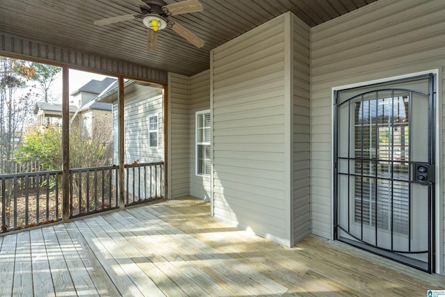 exterior space featuring ceiling fan and wooden ceiling