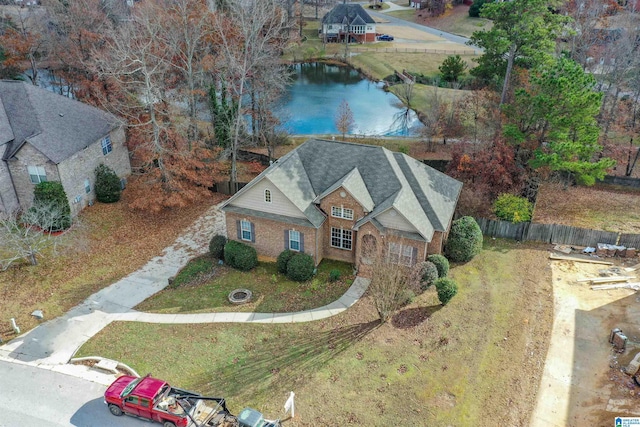 birds eye view of property with a water view