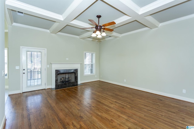 unfurnished living room featuring a high end fireplace, crown molding, a wealth of natural light, and dark wood-type flooring