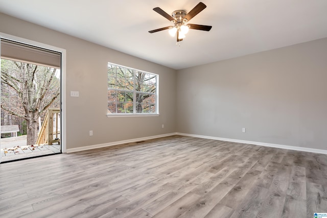 spare room featuring ceiling fan and light wood-type flooring