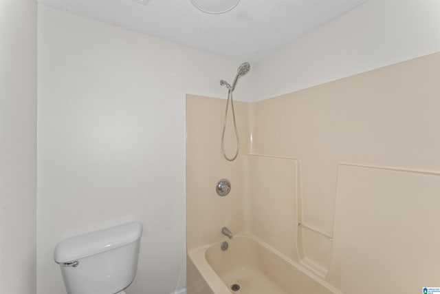 bathroom with toilet and tub / shower combination