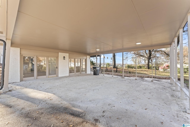 unfurnished sunroom featuring a wealth of natural light