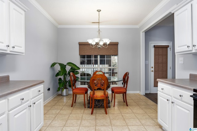 dining area featuring crown molding and a notable chandelier