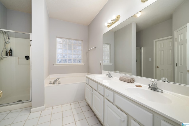 bathroom featuring tile patterned floors, vanity, and plus walk in shower