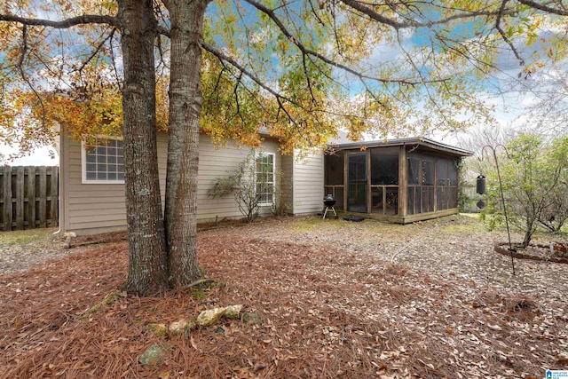 back of house with a sunroom