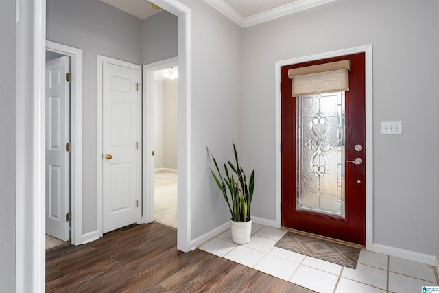 entrance foyer with wood-type flooring and crown molding