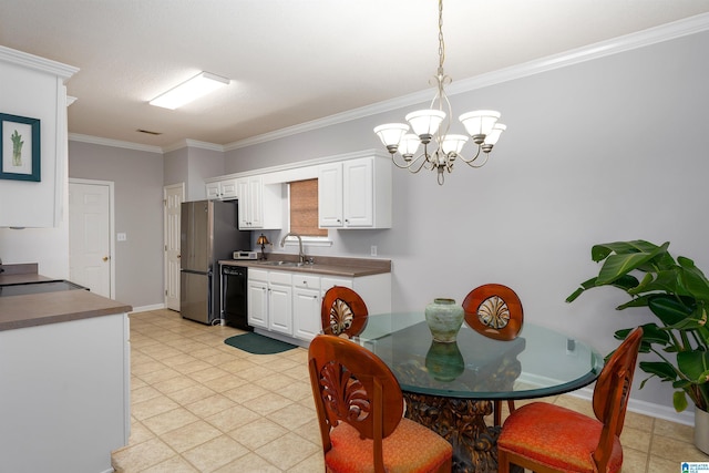 dining space featuring ornamental molding, sink, and a chandelier