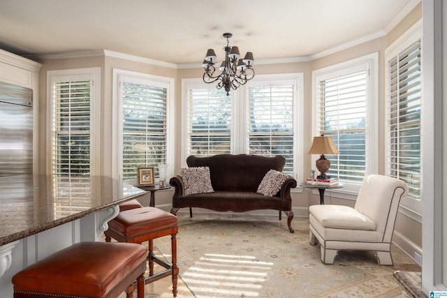 sunroom / solarium featuring a chandelier