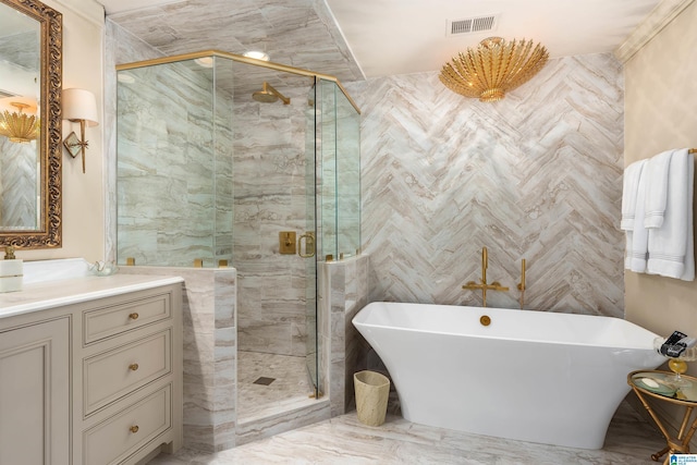 bathroom featuring vanity and separate shower and tub