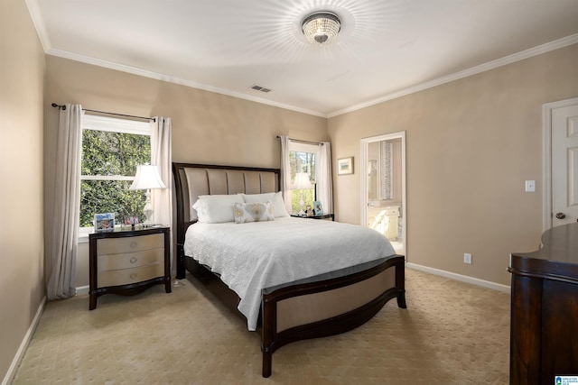 bedroom with ensuite bathroom, light carpet, and crown molding