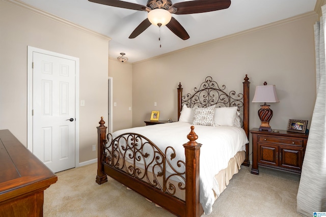 bedroom featuring crown molding, ceiling fan, and light carpet