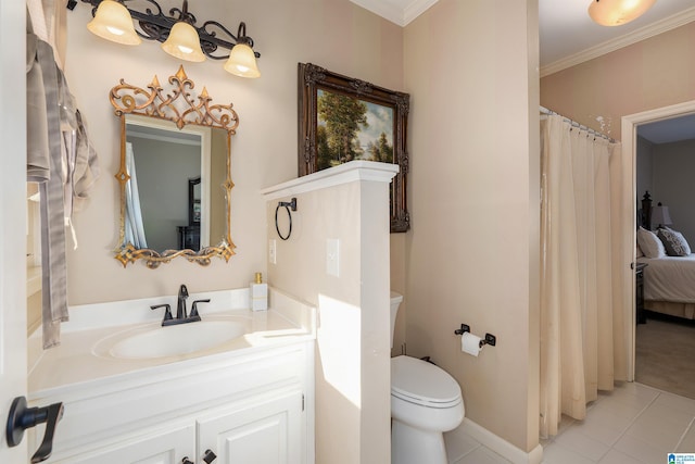 bathroom featuring vanity, crown molding, tile patterned floors, and toilet