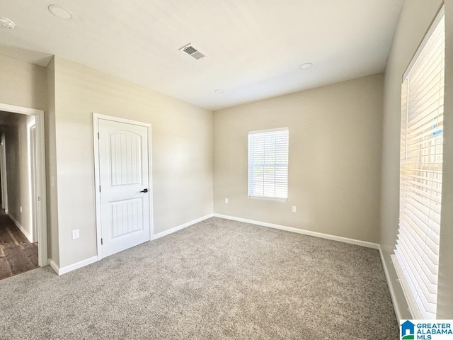 spare room with carpet flooring