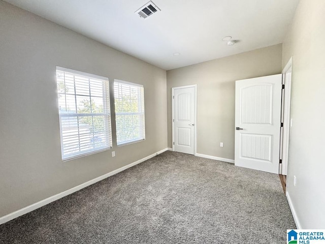 unfurnished bedroom featuring carpet