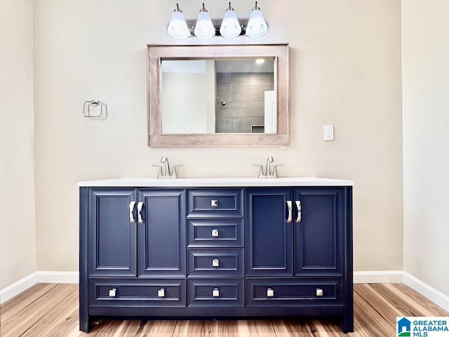 bathroom with vanity and hardwood / wood-style flooring