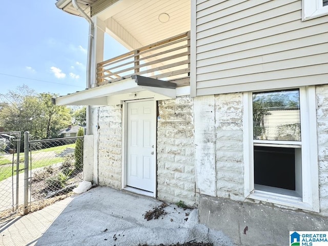 property entrance with a balcony