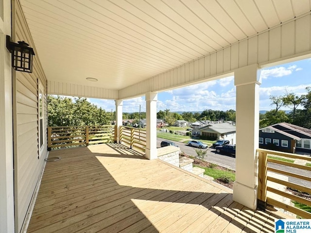 wooden deck featuring covered porch