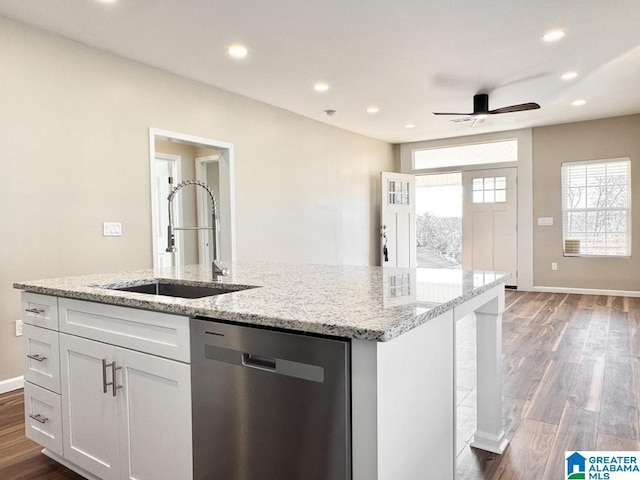 kitchen with ceiling fan, sink, dark hardwood / wood-style flooring, stainless steel dishwasher, and white cabinets