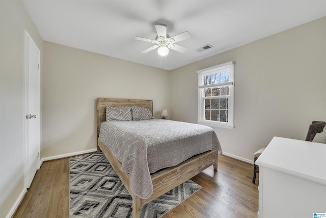 bedroom featuring ceiling fan and dark wood-type flooring