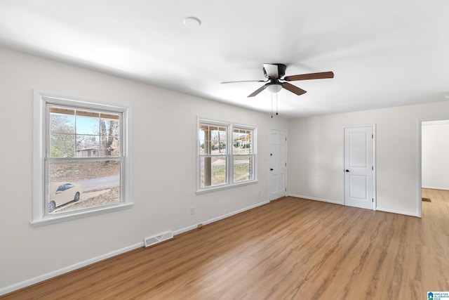 unfurnished bedroom featuring ceiling fan and light wood-type flooring