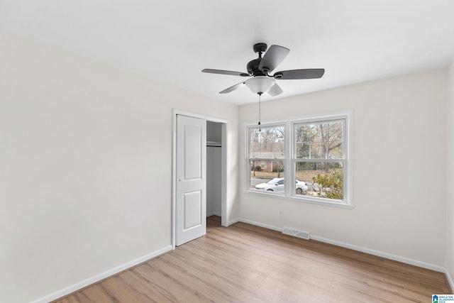 unfurnished room with ceiling fan and light hardwood / wood-style flooring