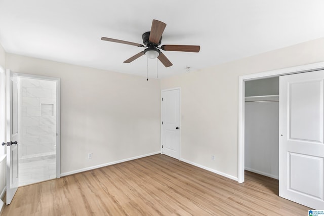 unfurnished bedroom featuring a closet, light wood-type flooring, ensuite bathroom, and ceiling fan