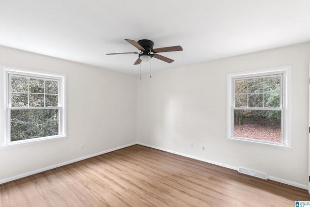 unfurnished room featuring ceiling fan and light hardwood / wood-style flooring