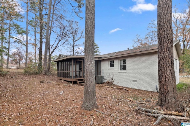 back of property featuring a sunroom