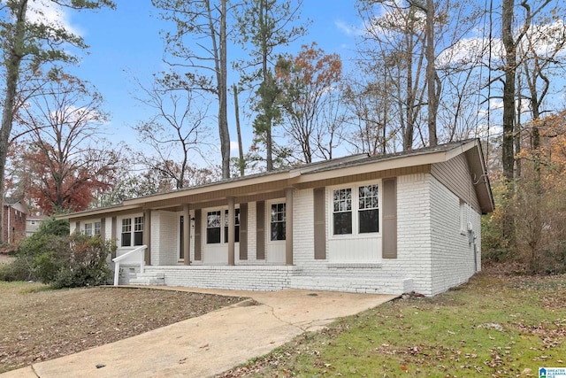 single story home featuring covered porch