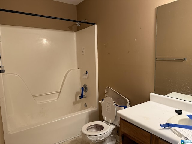 full bathroom with vanity, toilet, and  shower combination