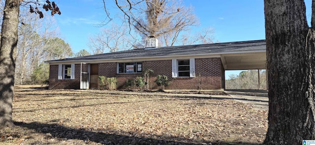 ranch-style home featuring a carport