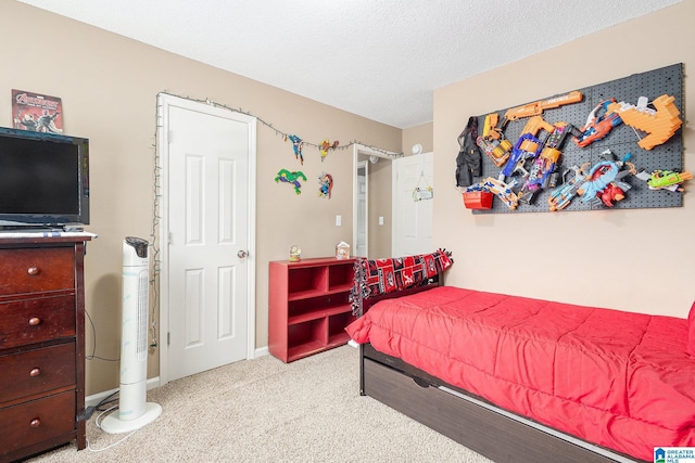 carpeted bedroom with a textured ceiling