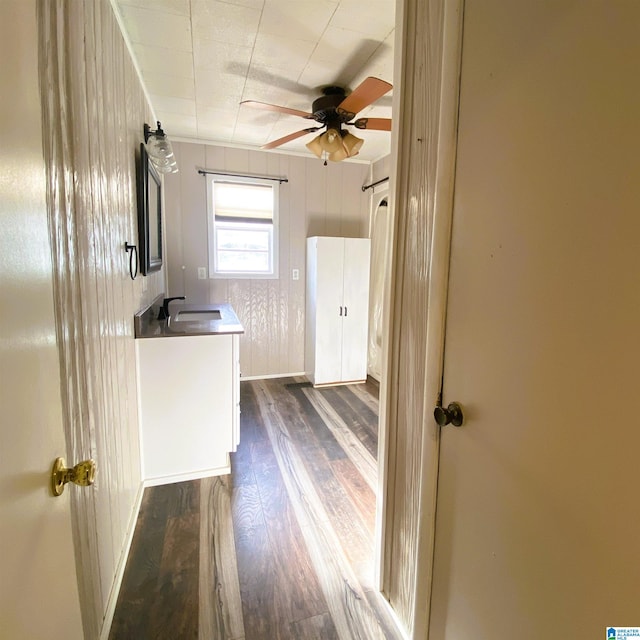 interior space with hardwood / wood-style flooring, vanity, and ceiling fan