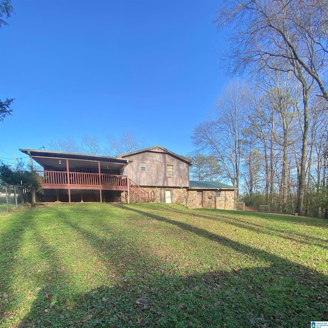 view of yard with a wooden deck