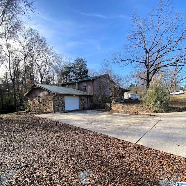 view of property exterior featuring a garage