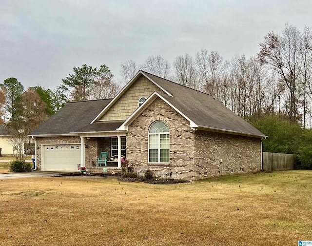 view of front facade with a front yard and a garage