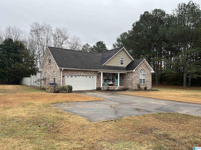 view of front of house with a garage and a front lawn