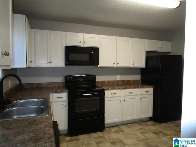 kitchen featuring a textured ceiling, sink, white cabinetry, and black appliances