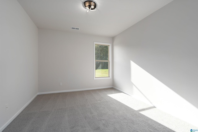 spare room with carpet floors