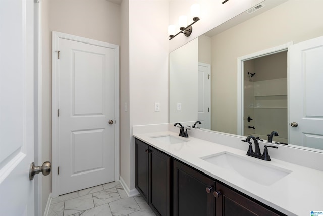 bathroom featuring vanity and tub / shower combination