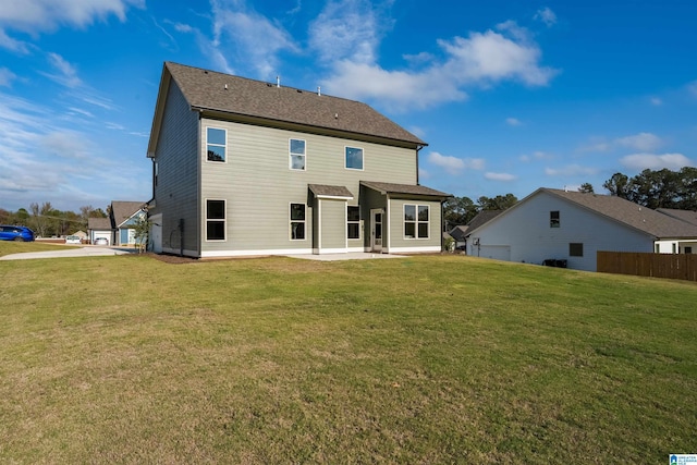 back of property featuring a yard and a patio area