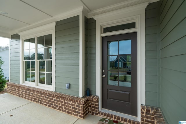 doorway to property with a porch