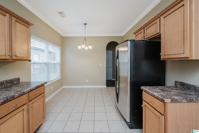 kitchen featuring stainless steel refrigerator, a notable chandelier, crown molding, decorative light fixtures, and light tile patterned floors