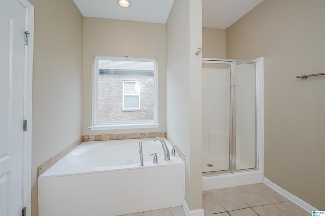 bathroom with tile patterned floors and separate shower and tub