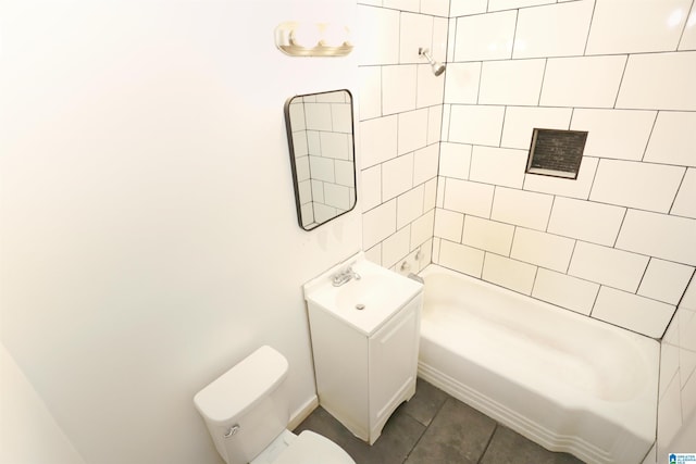 full bathroom featuring tile patterned flooring, vanity, toilet, and tiled shower / bath